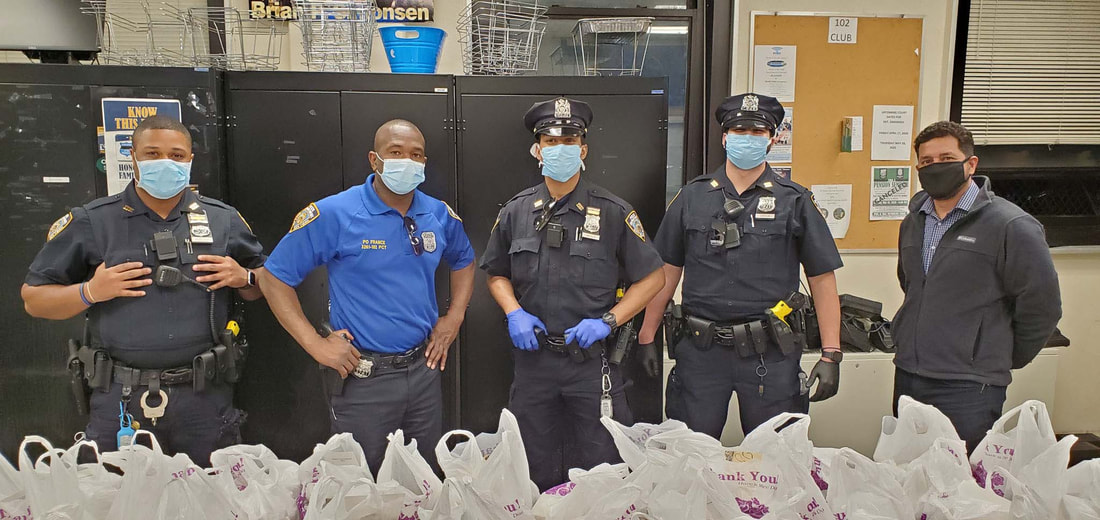 five police officers wearing face masks inside an office